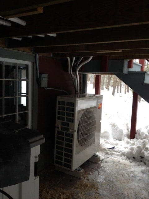 Ductless HVAC outdoor unit outside a colonial home in Carlisle, MA