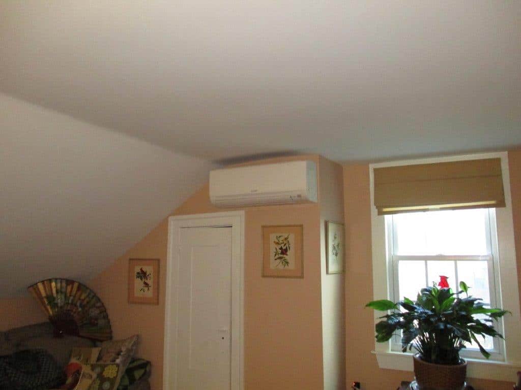 Indoor ductless AC installed in attic bedroom in Newburyport home.