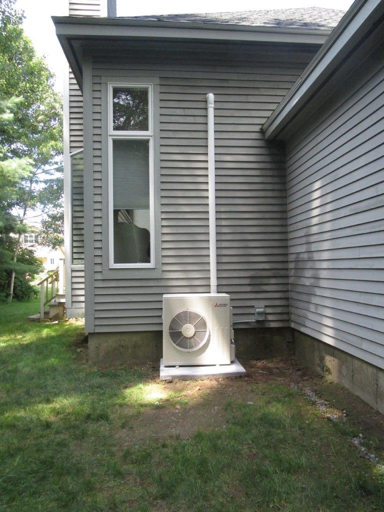 A heat pump in Beverly ,MA provides cooling for ductless units in a great room