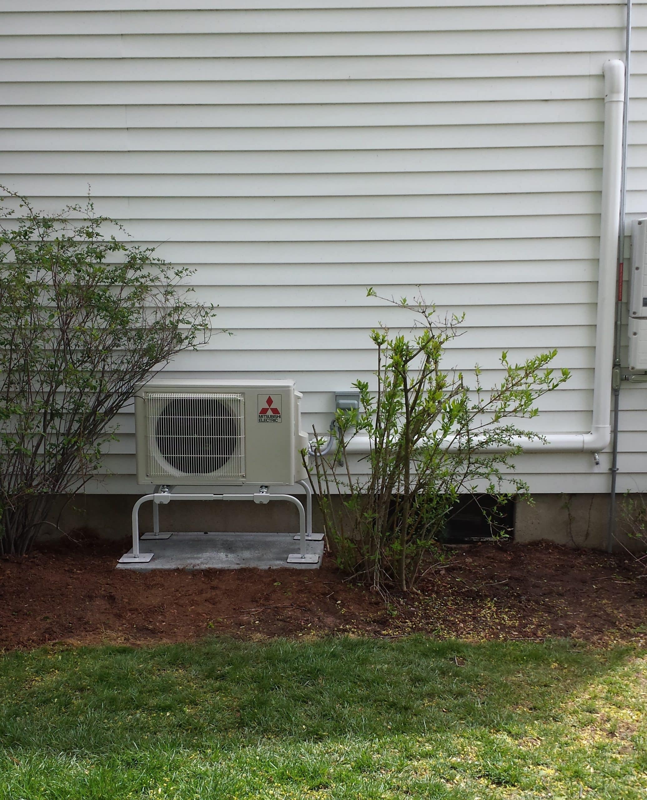 Home in Arlington, MA gets Mitsubishi ductless mini split system with outdoor condenser.