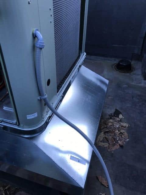 New heating unit installed on a parapet rooftop in Boston, MA.