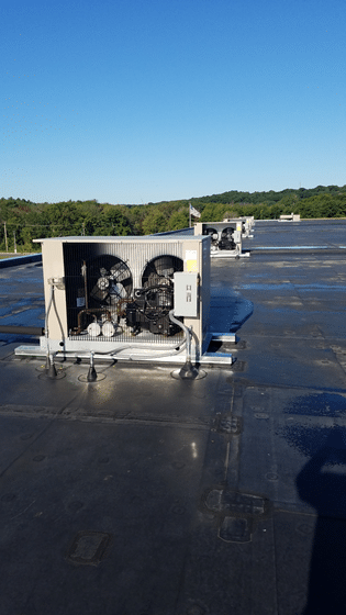Bohn condensers installed on the roof for commercial refrigeration installation.