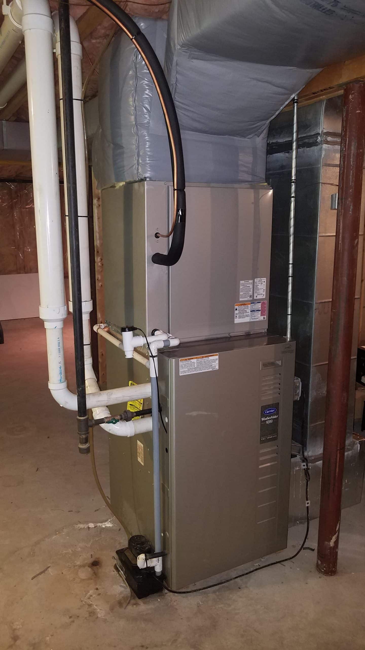 Carrier air handler installed on a furnace in Georgetown, MA, Colonial home for central HVAC system. 