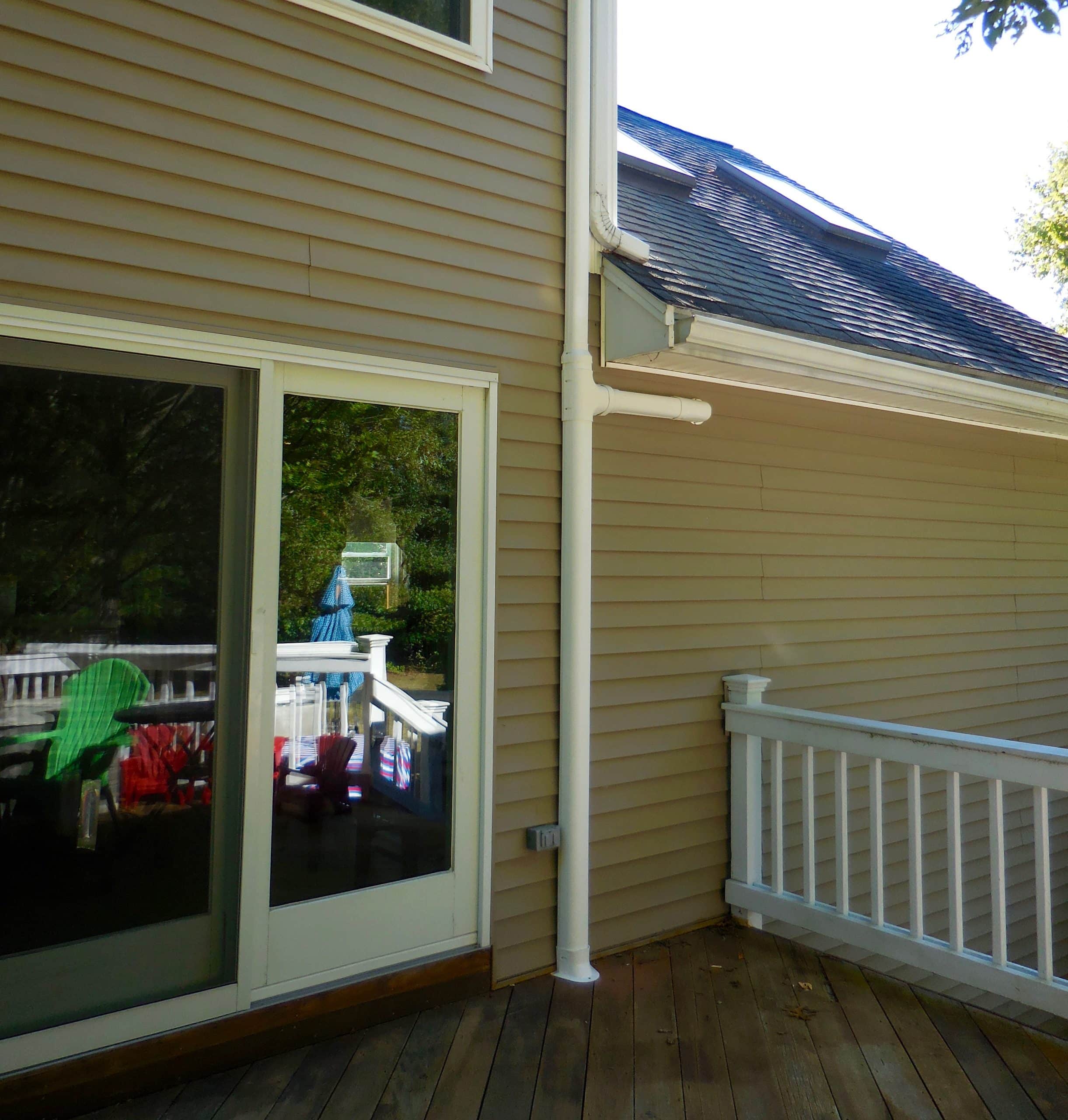 Outdoor piping for ductless system in Billerica second story.