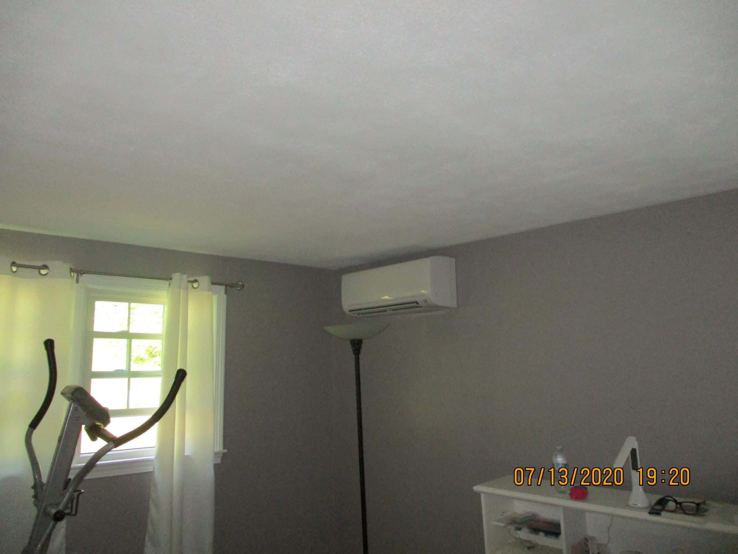 Ductless AC installed in Framingham, MA, split-level home.
