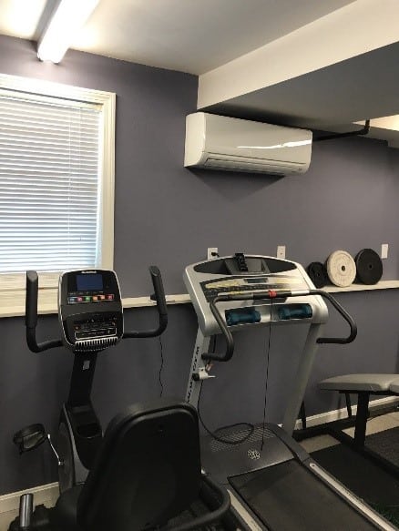 Ductless wall unit installed in a home gym in Hudson, NH.