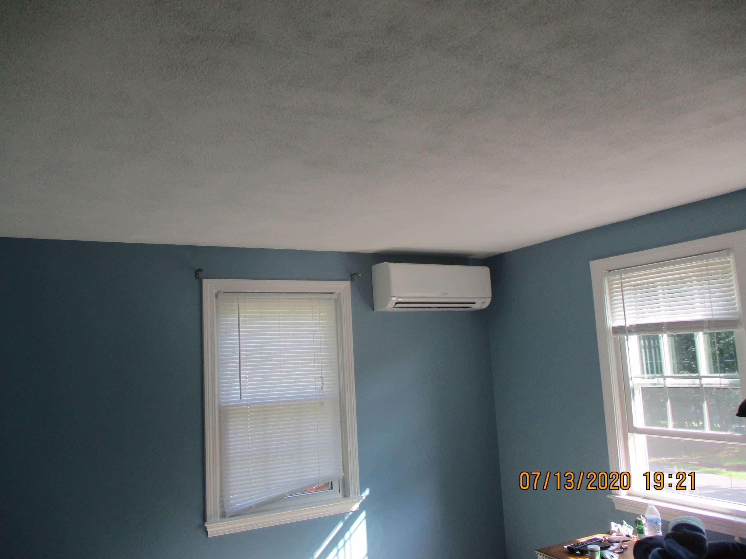 Example of an indoor ductless AC for new Mitsubishi system in Framingham, MA, split-level home.