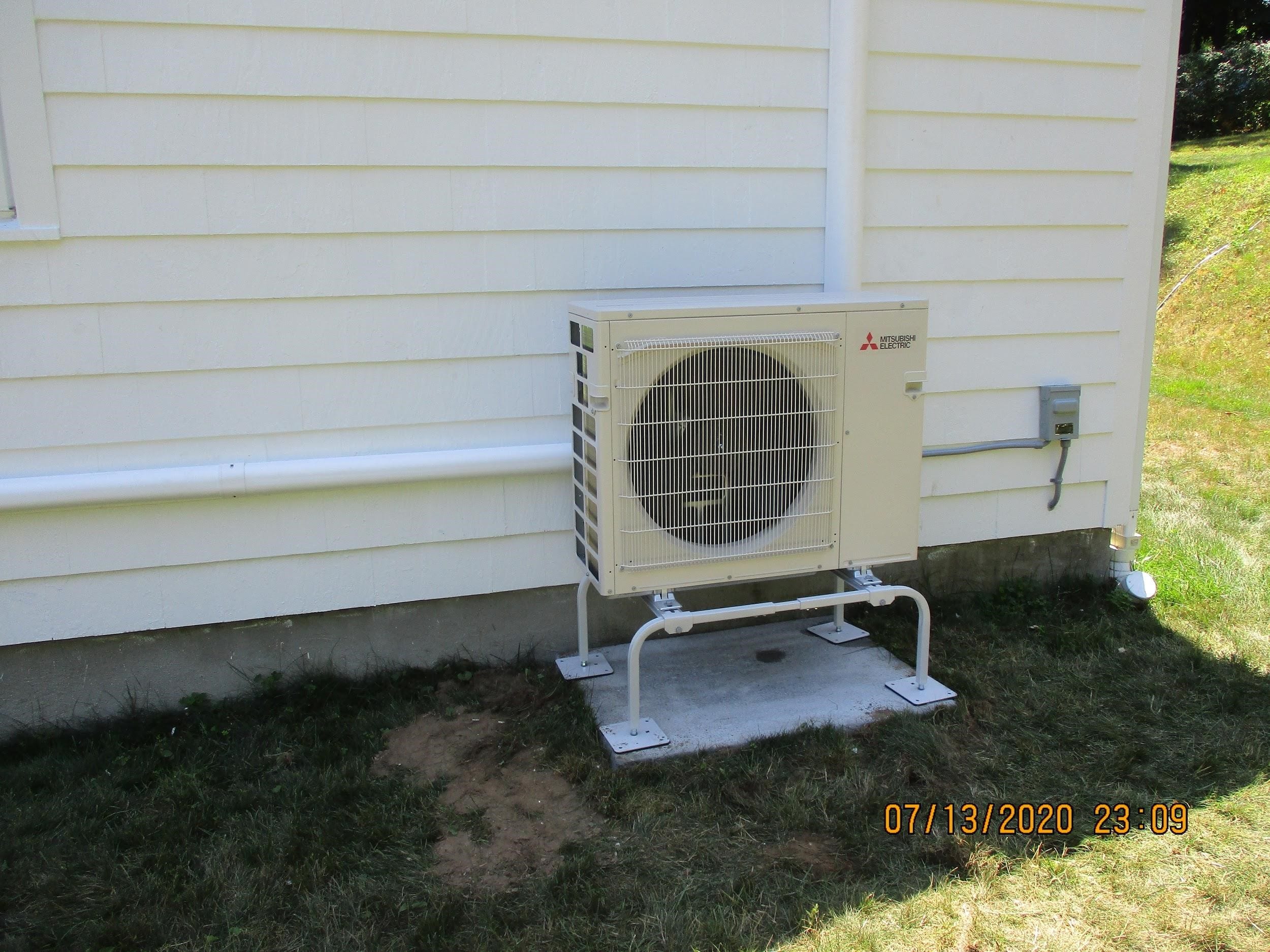 Example of an outdoor condenser unit installed in Framingham, MA, home for Mitsubishi ductless system.