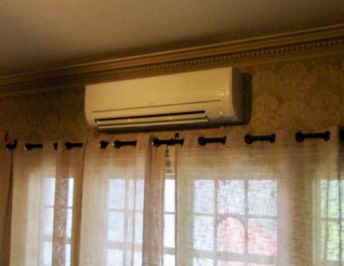 Indoor installation of ductless AC unit.