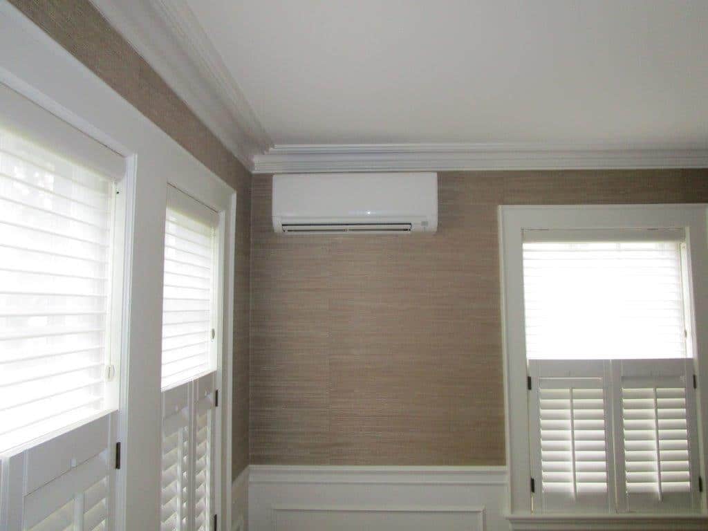 Mitsubishi ductless unit installation in Belmont, MA • Ductless units supplement radiator heat in Belmont, MA colonial home