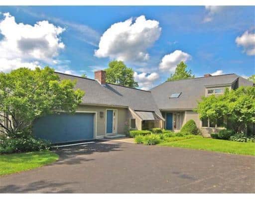 Contemporary cape-style home in Winchester, MA, upgrades old AC system for central AC.