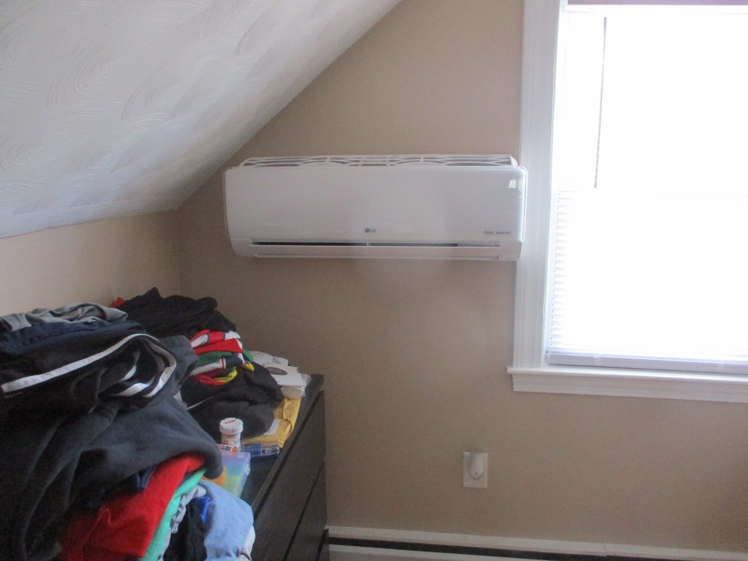 Indoor LG ductless air handler in Tewksbury home bedroom. 