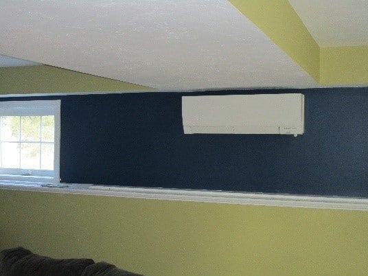 Indoor Mitsubishi ductless wall AC with Hyper Heat installed in Townsend family room.