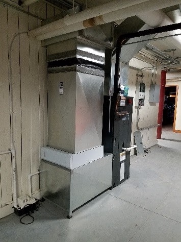 Installation of air handler with air cleaner for central AC in Weston, MA.