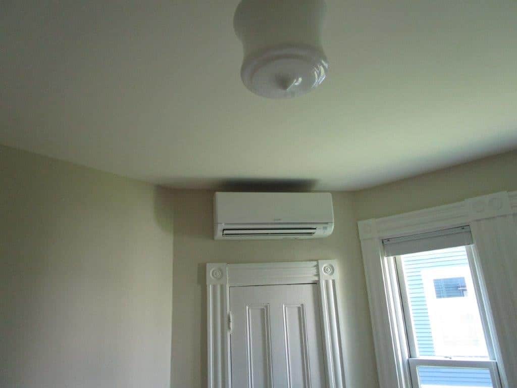 Mitsubishi ductless AC unit installed in Victorian-style condo. 