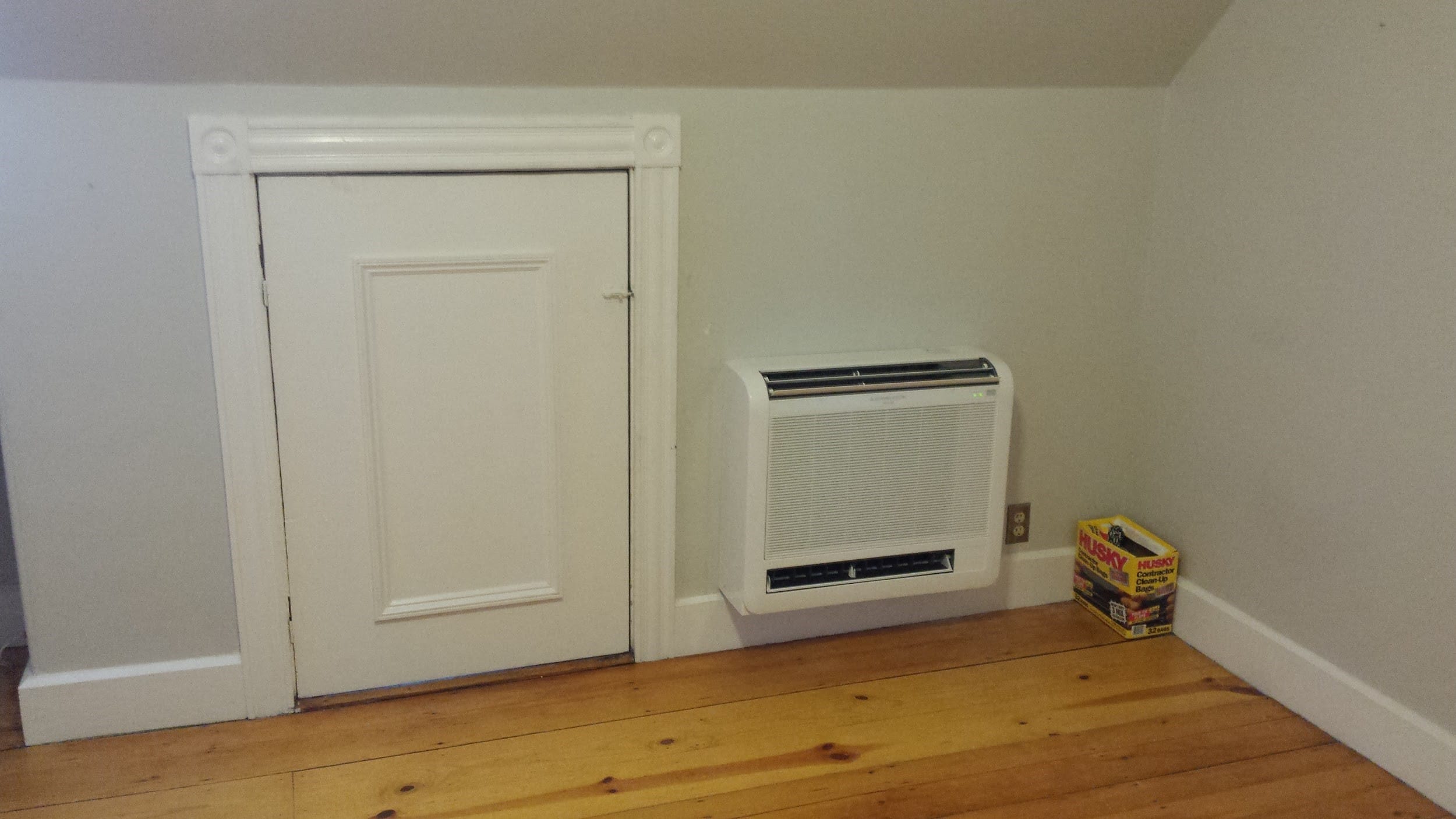 Mitsubishi ductless floor AC installed in Jamaica Plain Victorian home. 