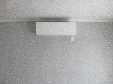 Mitsubishi ductless heating and cooling unit installed in Somerville home.