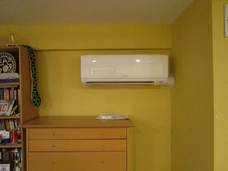 Multi-family home gets year-round comfort with Mitsubishi ductless with this indoor wall AC.