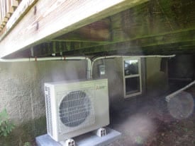 Outdoor example of Mitsubishi heat pump condenser unit.