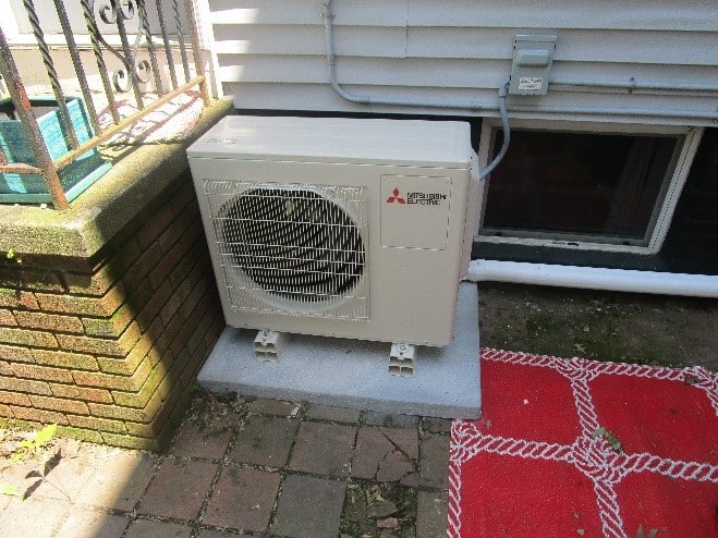 Outdoor condenser unit for Mitsubishi ductless system in condo.