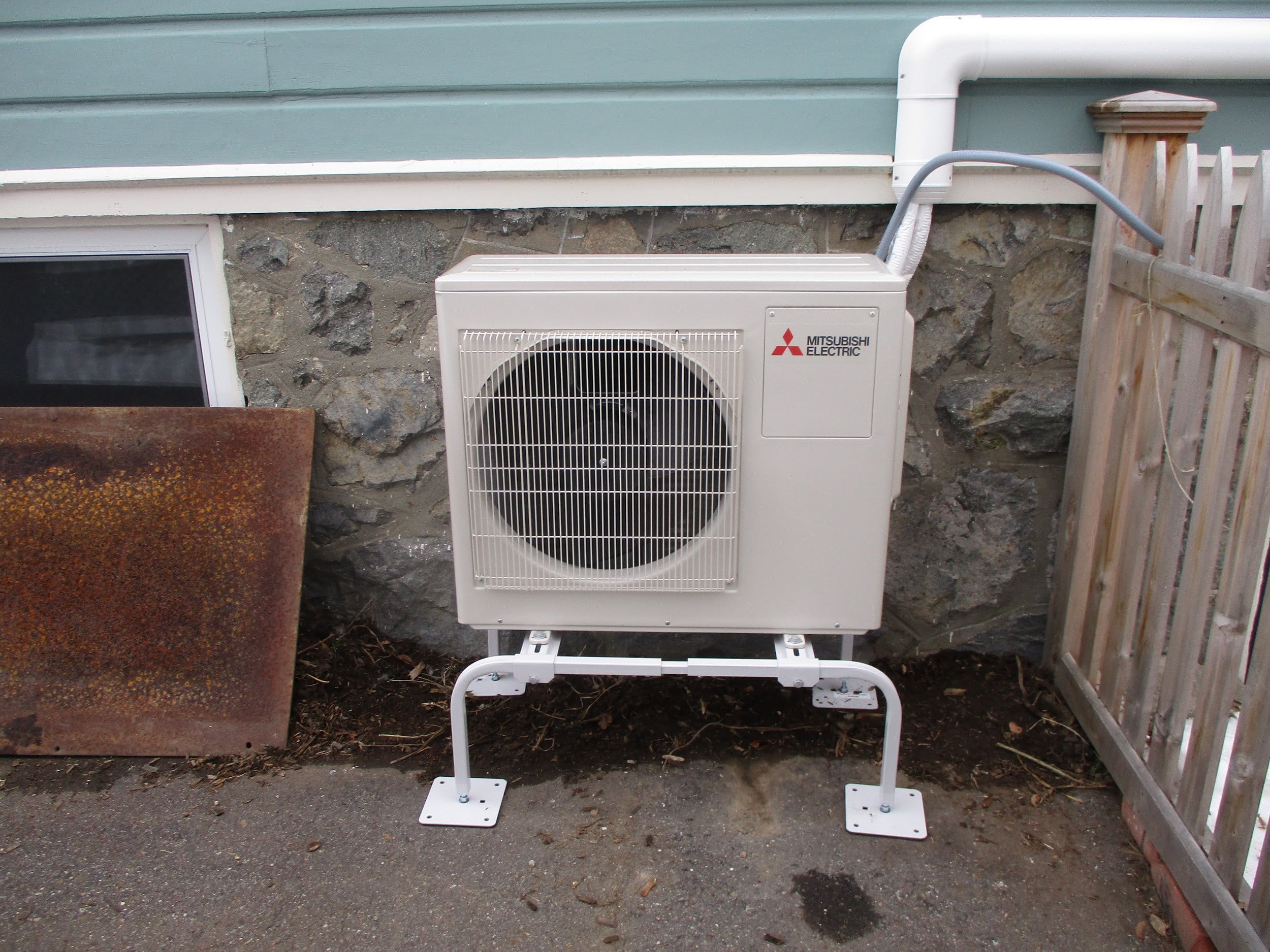 Outdoor condenser unit for Mitsubishi ductless heating and cooling system.