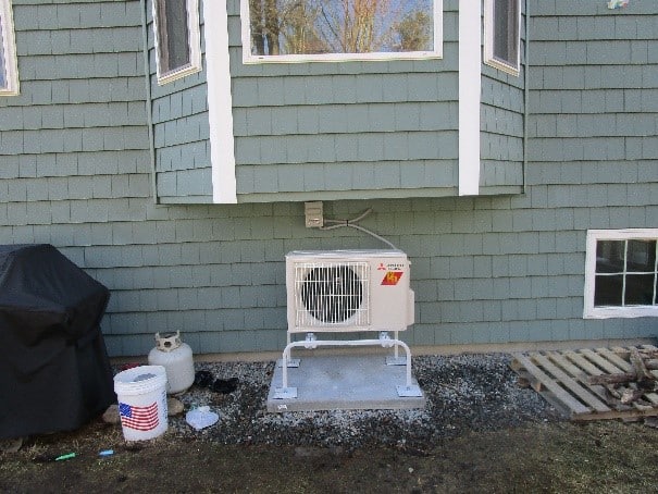 Outdoor condenser with Hyper-Heating technology tucked away in Townsend, MA.