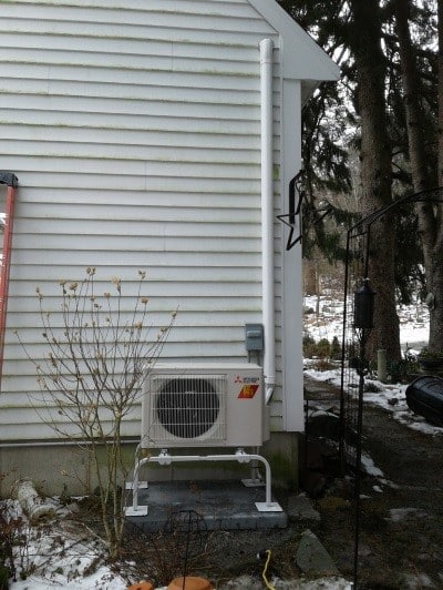 Outdoor condenser with heat pump for ductless heating and air conditioning in Beverly, MA.