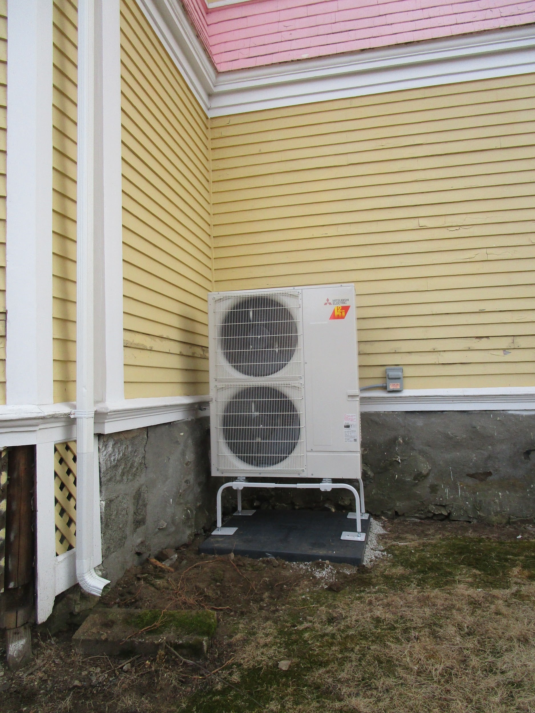 Outdoor condenser installed for Mitsubishi ductless AC system in Melrose, MA.