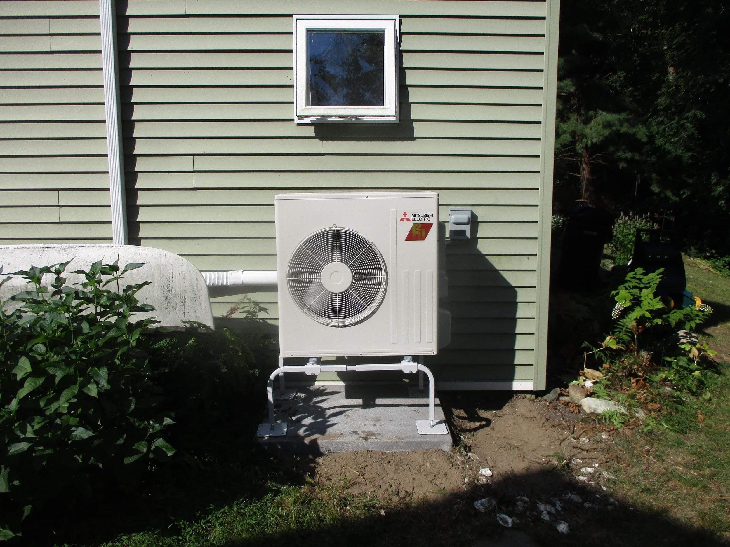 Outdoor heat pump installed for Mitsubishi system in Framingham home.