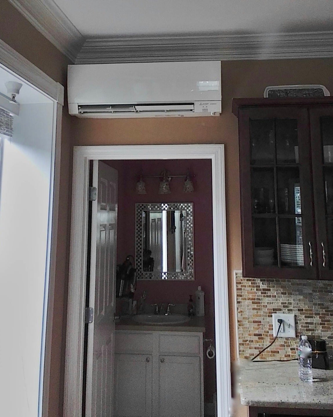 Indoor example of a wall mounted ductless unit in Brownstone kitchen