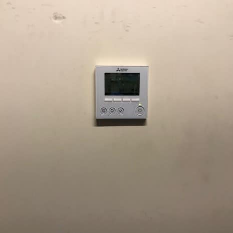 Thermostat for controlling the commercial HVAC system in Foxborough, MA, business building.