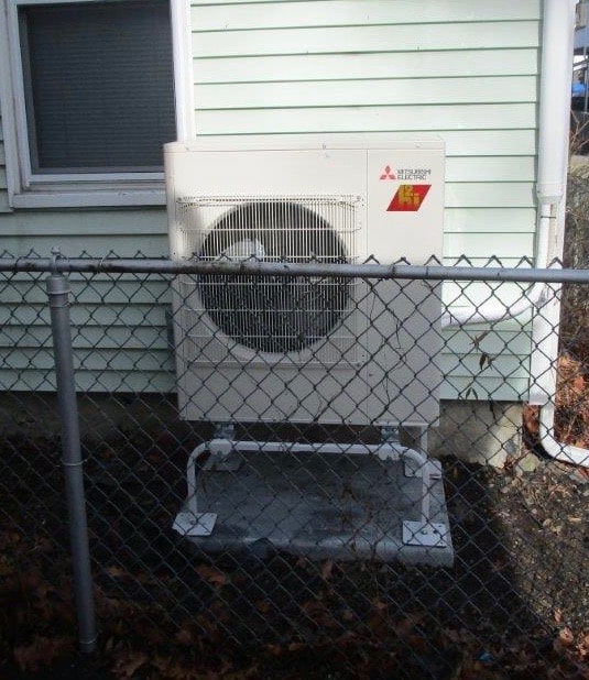 Outdoor ductless air conditioner condenser unit installation.