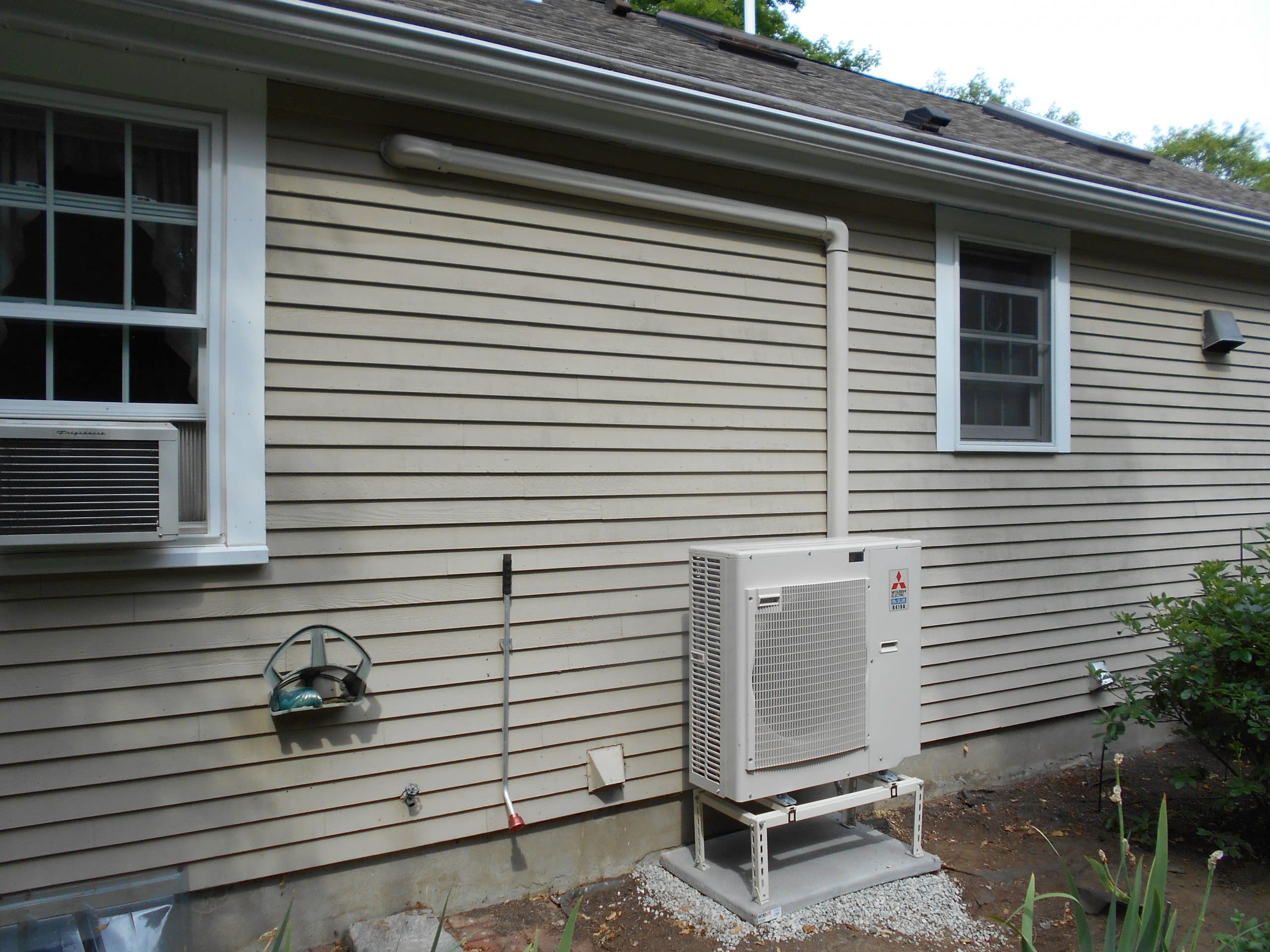 Ductless HVAC Outdoor Heat Pump Condenser in Lincoln MA Ranch Home