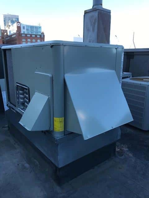 Boston, MA, funeral home gets replacement heating unit installed on the roof.