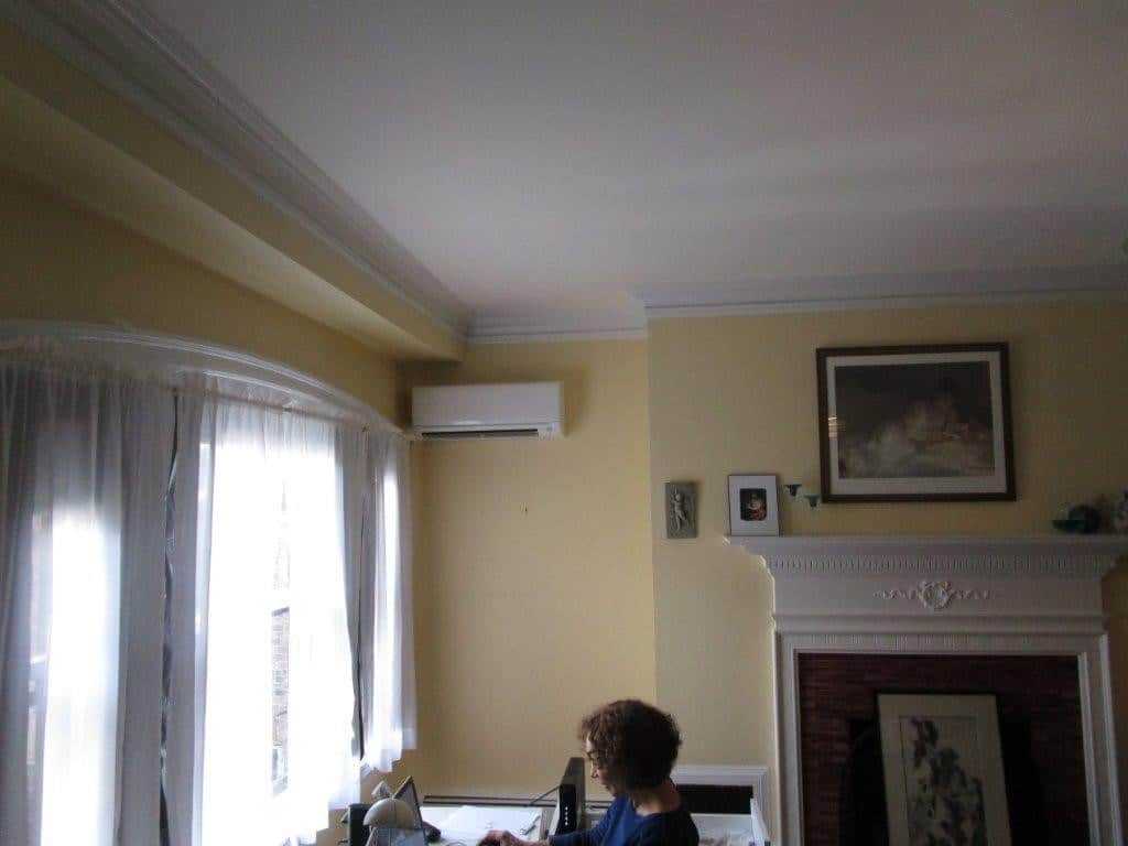 Example of an indoor Mitsubishi ductless AC installed in a living room.