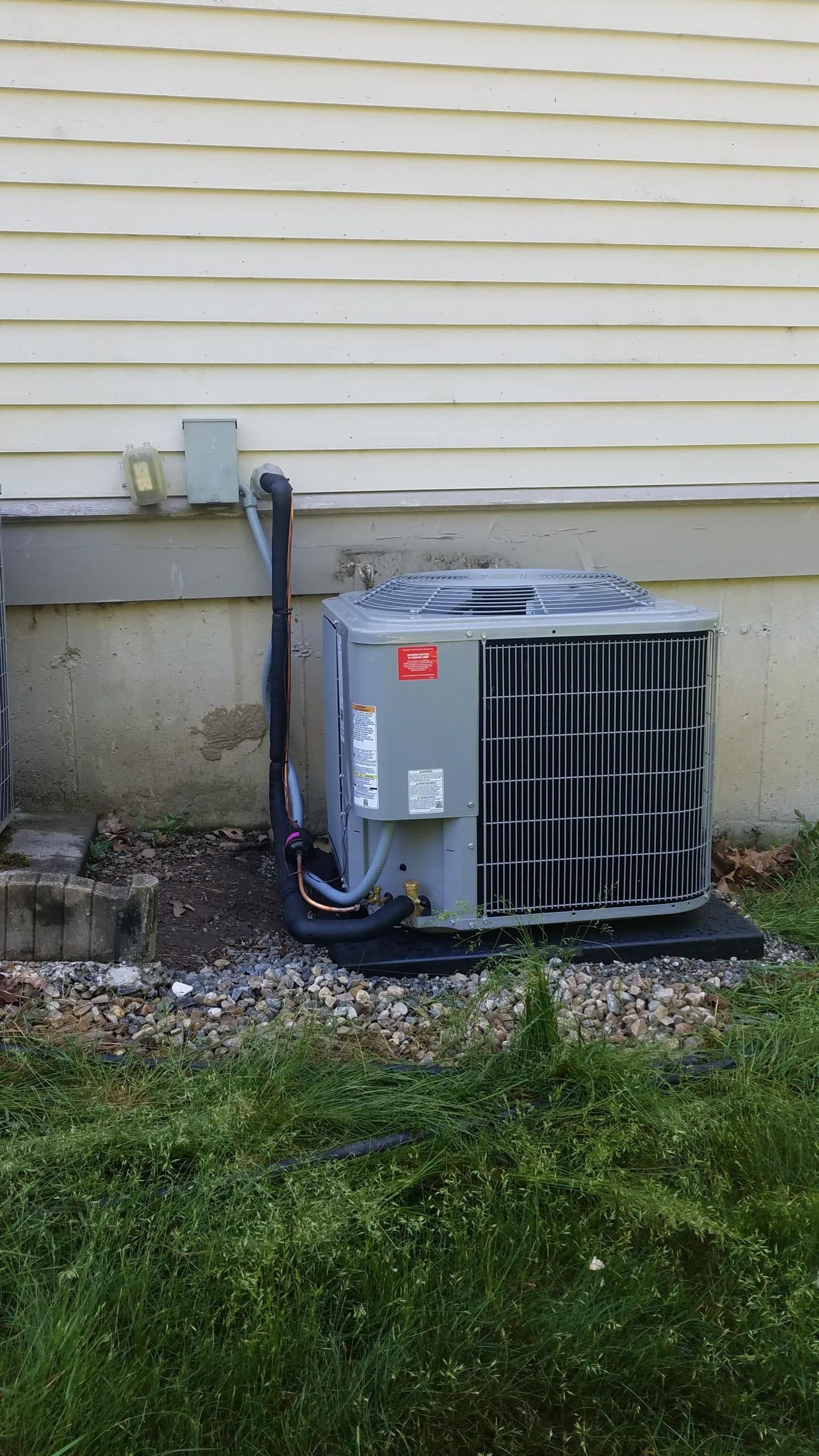 Example of an outdoor condenser unit for central air HVAC system installed in Georgetown, MA.