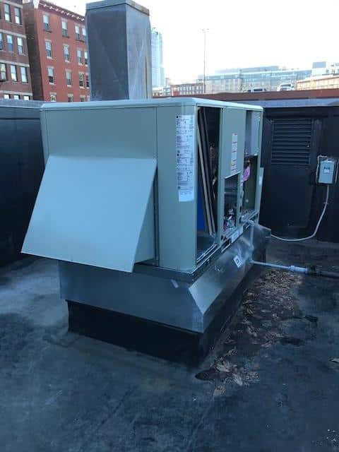 Outdoor condenser unit for American Standard HVAC system in Boston.