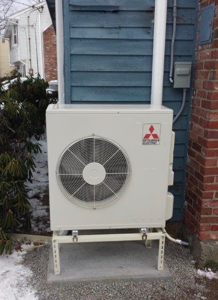 Outdoor heat condenser unit of Mitsubishi ductless HVAC system in Winchester, MA