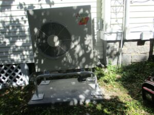 Mitsubishi ductless outdoor condenser unit installed outside Swampscott, MA, home.