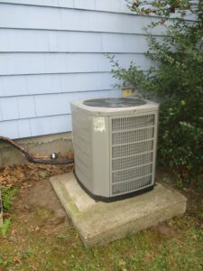 Outdoor 2.5 ton 13 SEER American Standard condenser unit installed for new HVAC system in Lexington Colonial home.