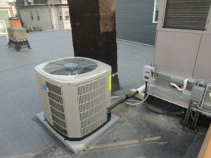 Outdoor air condenser for 16-Seer American Standard AC system in Charlestown condo.
