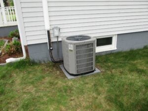 Outdoor condenser unit installed in Lowell, MA, for a replacement AC system.