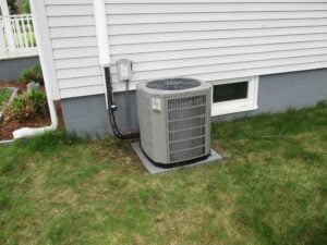 Outdoor condenser unit installed in Lowell, MA, for a replacement AC system. 