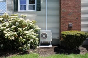 Example of an outdoor air condenser installed in a split-level home in Beverly, MA, for a Mitsubishi ductless air conditioning system.