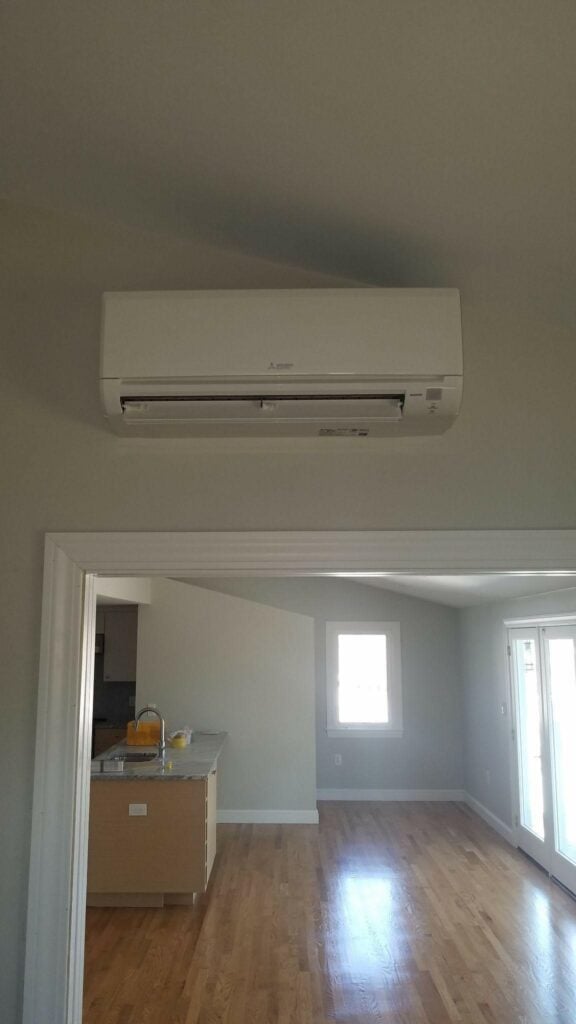 New air handler installed inside the an Arlington, MA, home for Mitsubishi ductless AC system upgrade.