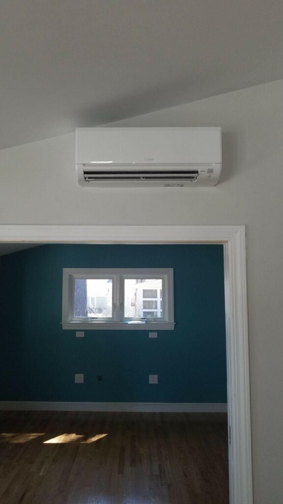 New air handler installed inside the an Arlington, MA, home for Mitsubishi ductless AC system upgrade.