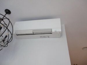 A Mitsubishi Electric ductless unit installed in a home in Boston for an air conditioning system with a high-quality heat pump.