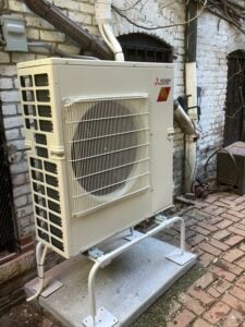 An outdoor condenser unit installed for Mitsubishi Electric ductless AC system installed in Boston condo