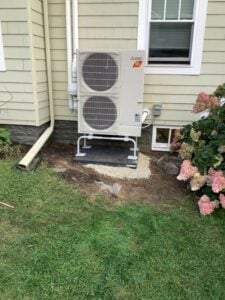Example of an outdoor Mitsubishi Electric heat pump installed for heating and cooling upgrade in Winchester, MA.