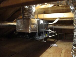 Air handler with ductwork installed in the attic of this Beverly, MA, home.